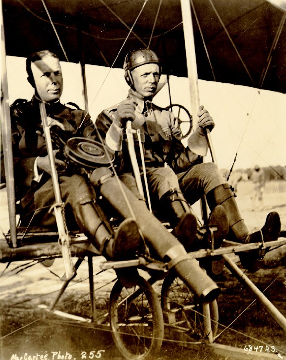 Captain Charles deForest Chandler mans a prototype Lewis machine gun with Lieutenant Roy C. Kirtland at the controls of a Wright Model B, at College Park, MD. (U.S. Air Force)